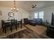 Open-concept living space with dining area, comfortable seating, and vaulted ceilings at 8700 E University Dr # 1947, Mesa, AZ 85207
