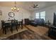 Bright living space with dining area, comfortable seating, and ceiling fan at 8700 E University Dr # 1947, Mesa, AZ 85207