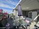 Stylish covered patio offers a relaxing outdoor space with a table and chairs for enjoying the weather at 8700 E University Dr # 1947, Mesa, AZ 85207