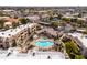 Aerial view of resort style community with a pool, desert landscaping, tennis courts and ample parking at 9450 E Becker Ln # 2019, Scottsdale, AZ 85260