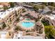 Aerial view of resort style community with a pool, desert landscaping, and ample parking at 9450 E Becker Ln # 2019, Scottsdale, AZ 85260