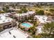 Aerial shot of residential buildings, pool and mature landscaping within the community at 9450 E Becker Ln # 2019, Scottsdale, AZ 85260