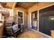 Inviting covered balcony with modern egg chair, jute rug and patio lights at 9450 E Becker Ln # 2019, Scottsdale, AZ 85260
