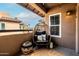 Cozy balcony featuring a comfortable egg chair, stylish decor, and neighborhood views at 9450 E Becker Ln # 2019, Scottsdale, AZ 85260