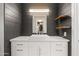 Modern bathroom featuring a vessel sink, floating shelves, and sleek gray shiplap walls at 9450 E Becker Ln # 2019, Scottsdale, AZ 85260