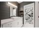 Modern bathroom featuring a vanity with sink and a glass-enclosed shower at 9450 E Becker Ln # 2019, Scottsdale, AZ 85260
