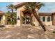 Inviting clubhouse entrance with modern architecture, palm trees, and a welcoming atmosphere at 9450 E Becker Ln # 2019, Scottsdale, AZ 85260