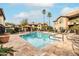 Inviting community pool with ample lounge chairs and desert landscaping at 9450 E Becker Ln # 2019, Scottsdale, AZ 85260