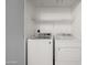 Laundry room featuring a white washer and dryer, providing convenient in-home laundry solutions at 9450 E Becker Ln # 2019, Scottsdale, AZ 85260