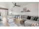 Spacious living room with a large sofa and a view of the dining area and kitchen at 9450 E Becker Ln # 2019, Scottsdale, AZ 85260