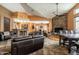Spacious community lounge with a stone fireplace, comfortable seating, and a relaxed atmosphere at 9450 E Becker Ln # 2019, Scottsdale, AZ 85260