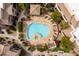 Overhead view of the community pool with lounge chairs and beautiful landscaping at this property at 9450 E Becker Ln # 2019, Scottsdale, AZ 85260
