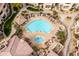 Aerial view of the community pool with lounge chairs and well-maintained landscaping at the property at 9450 E Becker Ln # 2019, Scottsdale, AZ 85260