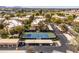 Overhead view of the tennis courts, parking, and residential buildings at this community at 9450 E Becker Ln # 2019, Scottsdale, AZ 85260