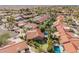 An aerial view highlighting pools and mature trees in this attractive neighborhood at 10500 E Mission Ln, Scottsdale, AZ 85258