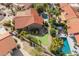 Expansive backyard featuring a putting green and a sparkling pool, framed by lush landscaping and palm trees at 10500 E Mission Ln, Scottsdale, AZ 85258