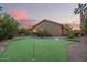 This property features a backyard putting green and desert landscaping at 10500 E Mission Ln, Scottsdale, AZ 85258