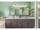 Stylish double vanity with a large mirror, ample storage, and decorative shelves enhancing this bathroom at 10500 E Mission Ln, Scottsdale, AZ 85258