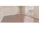 Clean, spacious bedroom with laminate flooring and a window with shutters at 10500 E Mission Ln, Scottsdale, AZ 85258
