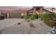 Charming single-story home with a well-manicured front yard and desert landscaping at 10500 E Mission Ln, Scottsdale, AZ 85258