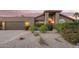 Charming single-story home with a well-manicured front yard and desert landscaping at 10500 E Mission Ln, Scottsdale, AZ 85258