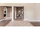 Neutral hallway with archway and views of the entryway and sitting room at 10500 E Mission Ln, Scottsdale, AZ 85258