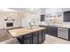 Stylish kitchen with granite countertops, stainless steel appliances, and ample cabinet space at 10500 E Mission Ln, Scottsdale, AZ 85258