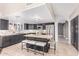 Well-equipped kitchen with granite counters, stainless appliances, and a large center island with seating at 10500 E Mission Ln, Scottsdale, AZ 85258
