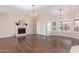 Spacious living room with fireplace and hardwood floors at 10500 E Mission Ln, Scottsdale, AZ 85258