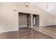 Open living room showcasing high ceilings, modern lighting, and entryway access to other rooms at 10500 E Mission Ln, Scottsdale, AZ 85258