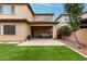 View of backyard with synthetic grass, patio, covered area and hot tub at 10535 E Simone Ave, Mesa, AZ 85212