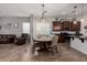 Kitchen and dining area feature stainless steel appliances, a large island, and seating at 10535 E Simone Ave, Mesa, AZ 85212