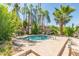 Community hot tub surrounded by mature landscaping, palm trees, and lounge chairs at 11515 N 91St St # 153, Scottsdale, AZ 85260