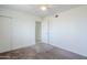 Bedroom with light walls, a ceiling fan and a closet at 1201 E Gemini Dr, Tempe, AZ 85283