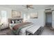 Cozy bedroom with plush bedding, ambient lighting, and neutral color palette at 1201 E Gemini Dr, Tempe, AZ 85283