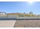 Charming single-story home featuring a brick accent wall, two-car garage, and desert landscaping at 1201 E Gemini Dr, Tempe, AZ 85283