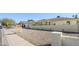 Charming single-story home featuring a brick accent wall, two-car garage, and desert landscaping at 1201 E Gemini Dr, Tempe, AZ 85283