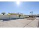Single-story home with neutral exterior, two-car garage, extended driveway and low-maintenance landscaping at 1201 E Gemini Dr, Tempe, AZ 85283