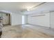 Unfinished garage space ready for personalization with lighting and storage at 1201 E Gemini Dr, Tempe, AZ 85283