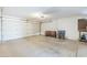 Spacious garage with a roll-up door and ample storage shelving at 1201 E Gemini Dr, Tempe, AZ 85283