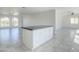 Open kitchen area with an island, offering a functional layout and connection to the living spaces at 1201 E Gemini Dr, Tempe, AZ 85283