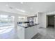 Open-concept kitchen with a center island, sliding glass doors and stainless steel appliances at 1201 E Gemini Dr, Tempe, AZ 85283