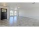 Bright living area featuring stylish tile floors, abundant light, and a dark wood front door at 1201 E Gemini Dr, Tempe, AZ 85283