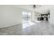 Spacious living room with tile floor, ceiling fan, and sliding doors leading to backyard pool area at 1201 E Gemini Dr, Tempe, AZ 85283