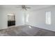The main bedroom features a large window with shutters and an attached bathroom with granite countertops at 1201 E Gemini Dr, Tempe, AZ 85283