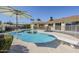 Backyard pool with a diving board and safety fence with patio at 1201 E Gemini Dr, Tempe, AZ 85283