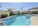Backyard pool area with diving board and patio umbrellas providing shade at 1201 E Gemini Dr, Tempe, AZ 85283