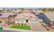 Lovely single-story home with a manicured lawn, hardscaped drive and colorful flowerbeds in a peaceful neighborhood at 13734 W Harvest Ave, Litchfield Park, AZ 85340