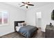 Bedroom features cozy bed, ceiling fan, and views to the backyard at 13734 W Harvest Ave, Litchfield Park, AZ 85340