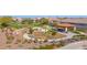 Community park with a playground, picnic benches, shade and open green spaces for leisure and recreation at 13734 W Harvest Ave, Litchfield Park, AZ 85340